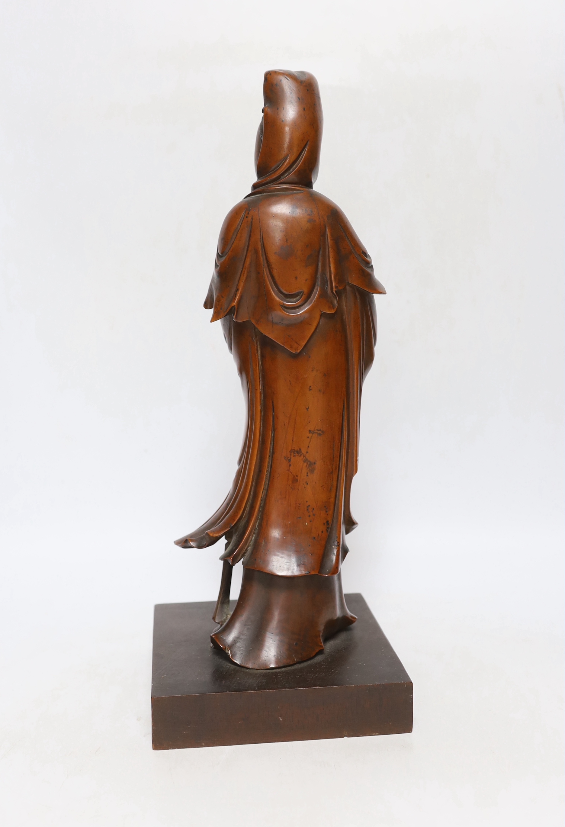 A Chinese carved boxwood figure of Guanyin, 19th century, 37cm high